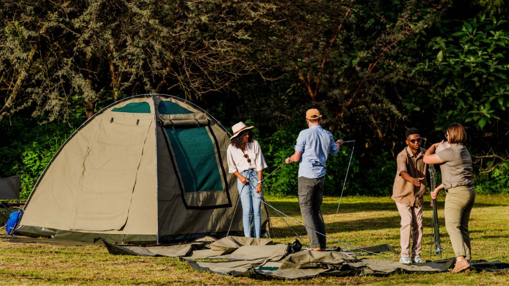 drifters camping tours/camping tour group setting up tents