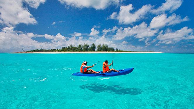 friends kayaking through calm waters