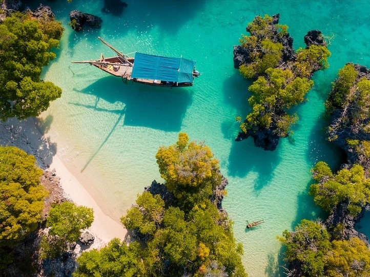 2025/zanzibar aerial view of boat in shallow waters